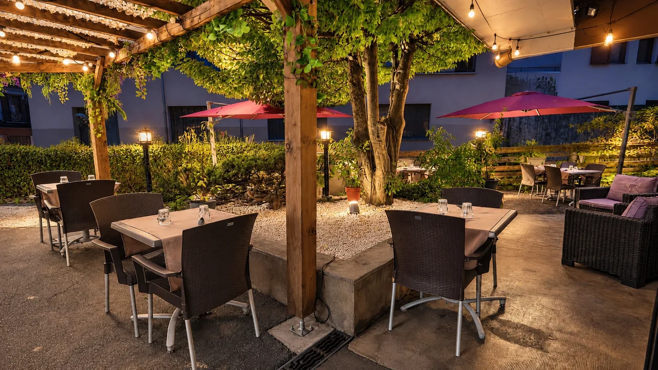 The terrace under the pergola, string lights on