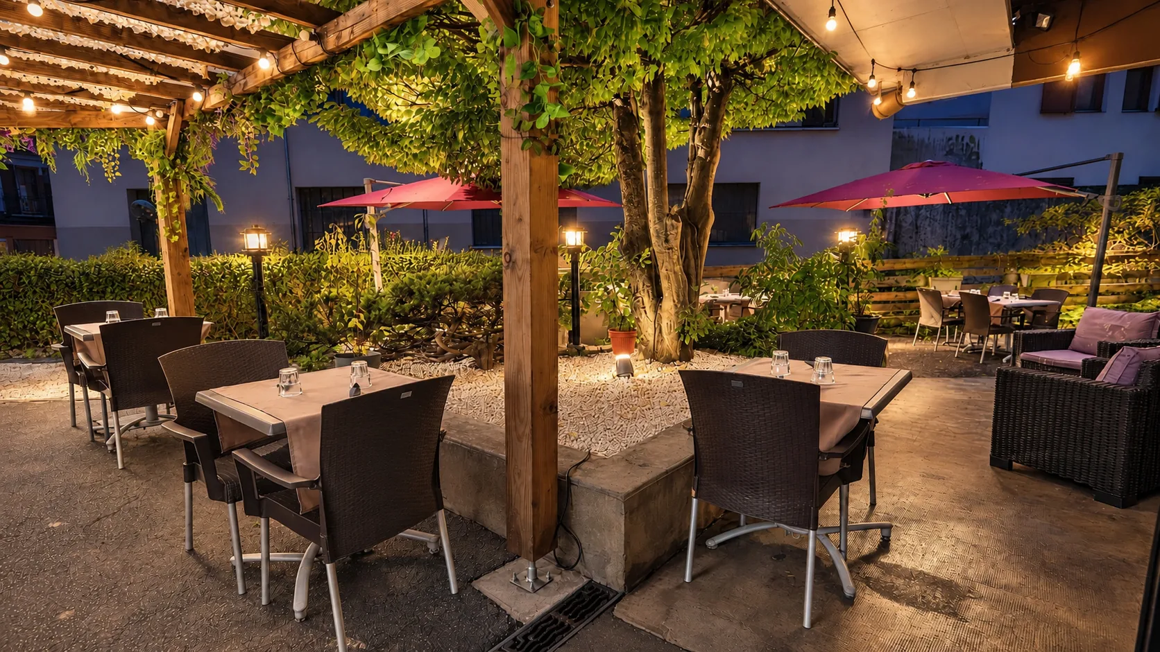 The terrace under the pergola, string lights on